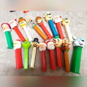 Big lot of Christmas pez. Snowman, Elf, Santa, reindeer, grinch, bear.